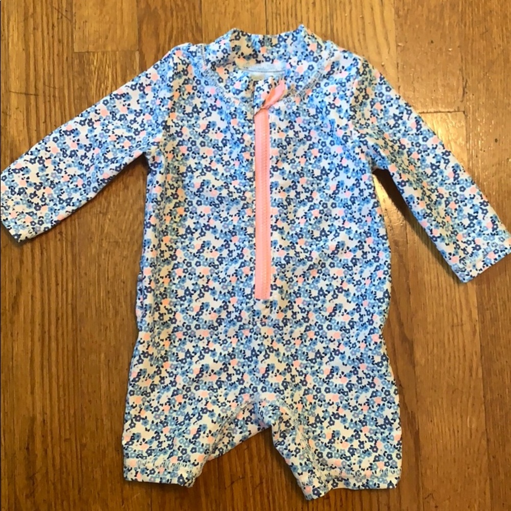 Long sleeve infant swimsuit.